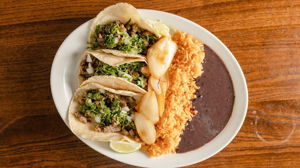 Taco Platter · Three Tacos Served with Rice and Beans. Topped with Onions and Cilantro.