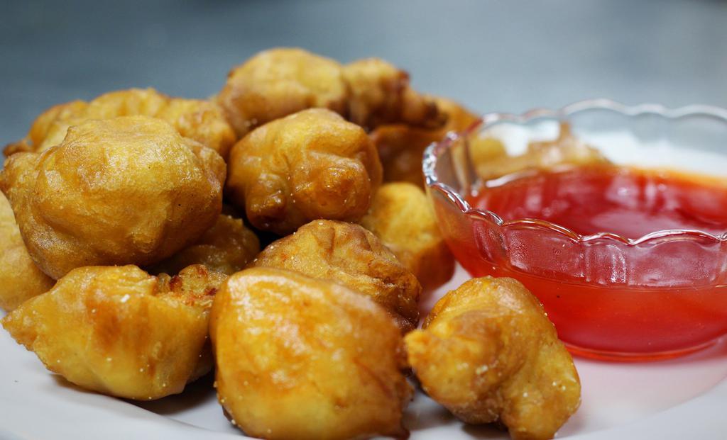 Sweet And Sour Chicken · Fried chicken breast coated with sweet and sour sauce