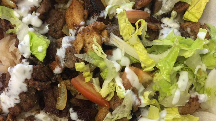 Lamb Over Rice · served with lettuce ,tomato, onion , with our home made white sauce