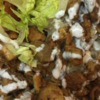 Chicken Over Rice (Gyros) · SERVED WITH LETTUCE ,TOMATO,ONIONS,WITH OUR HOMEMADE WHITE SAUCE