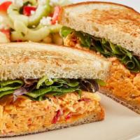 Spicy Pimento Cheese Sandwhich · With mixed lettuce on toasted bread. Served with chips and your choice of a homemade side