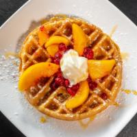 Fruit Melba Waffle · A Belgium waffle topped with Peaches, Raspberries and Powdered Sugar. Served with a Side of ...
