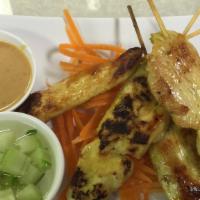 Satay Chicken (4 Pc) · Chicken on skewered marinated with thai herbs, served with peanut sauce and cucumber sauce.