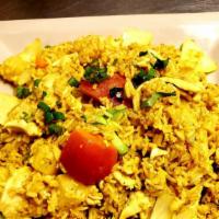 Pineapple Fried Rice · Stir-fried rice with chicken and shrimp, egg, cashew nut, onion, rasin and turmeric powder.