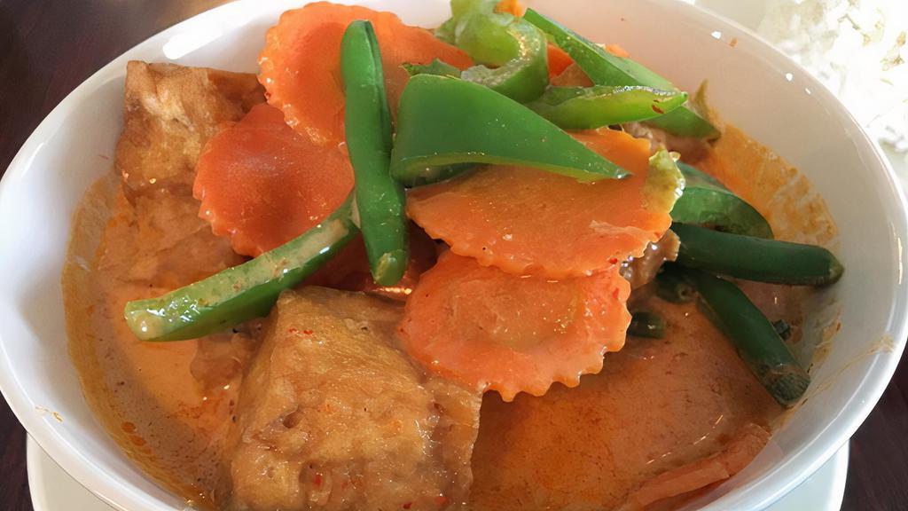 Panang Curry · Panang curry paste, coconut milk, green peas, carrot and bell pepper.