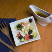 Mediterranean Salad · Our famous Mediterranean Salad comes with romaine lettuce mixed with our house-made vinaigre...