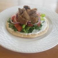 Gyro Sandwich · Our famous thinly sliced gyro topped with tzatziki, lettuce, tomato, and onion! Wrapped in w...