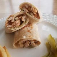 Chicken Shawarma · Our famous shawarma spiced chicken put in a sandwich with garlic mayonnaise, Arabic style pi...