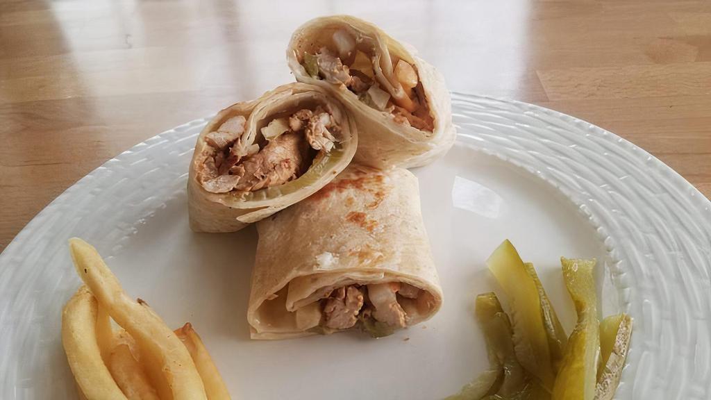Chicken Shawarma · Our famous shawarma spiced chicken put in a sandwich with garlic mayonnaise, Arabic style pickles, french fries all put together in a tortilla and grilled!