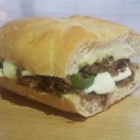 Philly Cheese Steak · Our famous Philly Cheese Steak topped with onions, bell peppers, mayonnaise, and topped with...