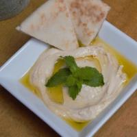 Hummus · A serving of our famous middle eastern hummus! Hummus is made of smashed chick peas, tahini,...