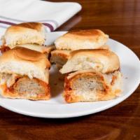 Meatball Sliders · Four Sliders with meatballs, marinara sauce, and Provolone cheese.
