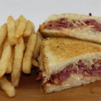 Leah'S Reuben · Hot corned beef with sauerkraut and  melted Swiss cheese served on grilled N.Y. rye