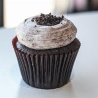 Cookies & Cream Cupcake · Chocolate cake with a cookies and ice cream buttercream icing and topped with Oreo crumbles.