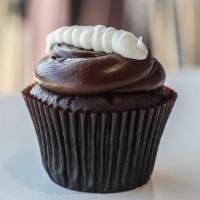 Chocolate Cream Cupcake · Chocolate cake with a cream filling, fudge icing, and a swirl of buttercream.