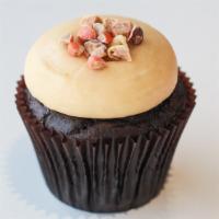 Peanut Butter Cupcake · Chocolate cake with peanut butter cream cheese icing and topped with Reese's crumbles.