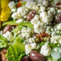 Greek Salad · Our mixed greens topped with Kalamata olives, grape tomatoes, green peppers, red onion, pepp...