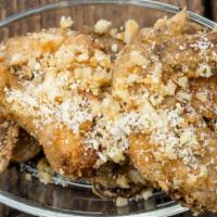 Garlic Parmesan Chicken Wings  · Classic bone-in chicken wings oven baked to perfection then smothered in a garlic parmesan m...
