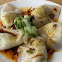 Steamed Dumplings · Five handmade edamame dumplings with soy sauce, house chili, and scallion oils.