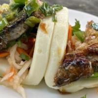 Bao Buns W/ Pork Belly · Two steamed rolls with pickled daikon and carrots, jalapeño, fresh cilantro, scallion oil, a...