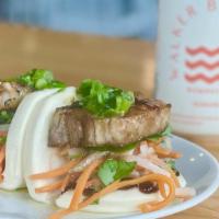 Bao Buns W/ Tofu · Two steamed rolls with pickled daikon and carrots, jalapeño, fresh cilantro, scallion oil, a...