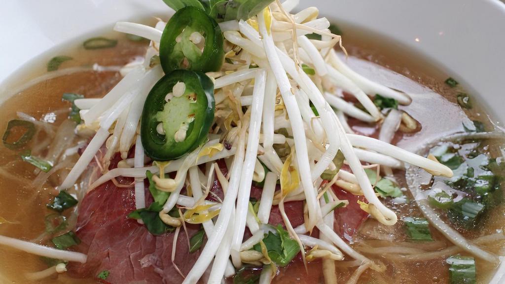 Original Pho W/ Beef · Twelve-hour combination bone broth with rice noodles, bean sprouts, onions, fresh scallions, fried shallots cilantro, thai basil, jalapeño, and lime.