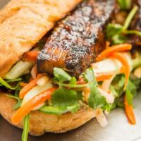 Original Banh Mi W/ Pork Belly · French baguette, green leaf lettuce, house-made paté, mayo, pickled daikon and carrots, cucu...