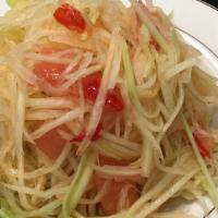 Papaya Salad · Spicy. Green papaya, roasted peanut, string bean, and tomatoes in spicy lime dressing.