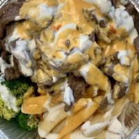 Chopped Steak · 8 oz. hamburger grilled with onions and mushrooms and topped with gravy. Served with fries.