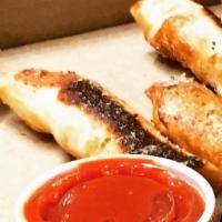 Pepperoni Breadsticks · Our pizza dough and our spicy Ezzo pepperoni rolled into about the best breadstick you have ...
