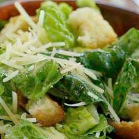 Caesar Salad · Romaine lettuce, tomatoes, croutons, and shaved pecorino cheese with Caesar dressing.