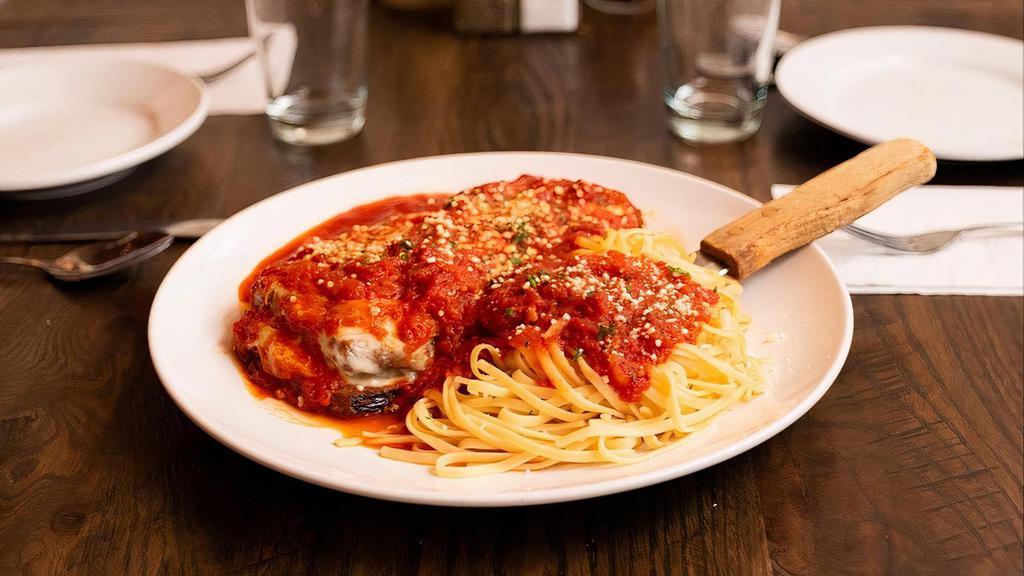Chicken Parmigiana · Breaded Chicken meat with Mozzarella Cheese over the Spaghetti with Homemade Marinara sauce