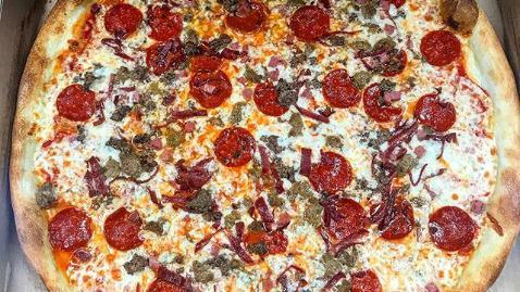 Meat Deluxe Pizza · Pepperoni, sausage, ham, bacon, and ground beef.