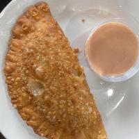Empanada · A flavorful Latin pastry turnover filled with: beef, chicken, jerk chicken, spinach and chee...