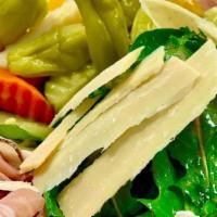 Antipasto Salad · Lettuce, salami, tomato, ham, mozzarella, black olives, and dressing.