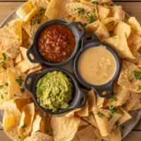 Trio Dips & Chips · house-made: salsa, guacamole, queso, crispy tortilla chips