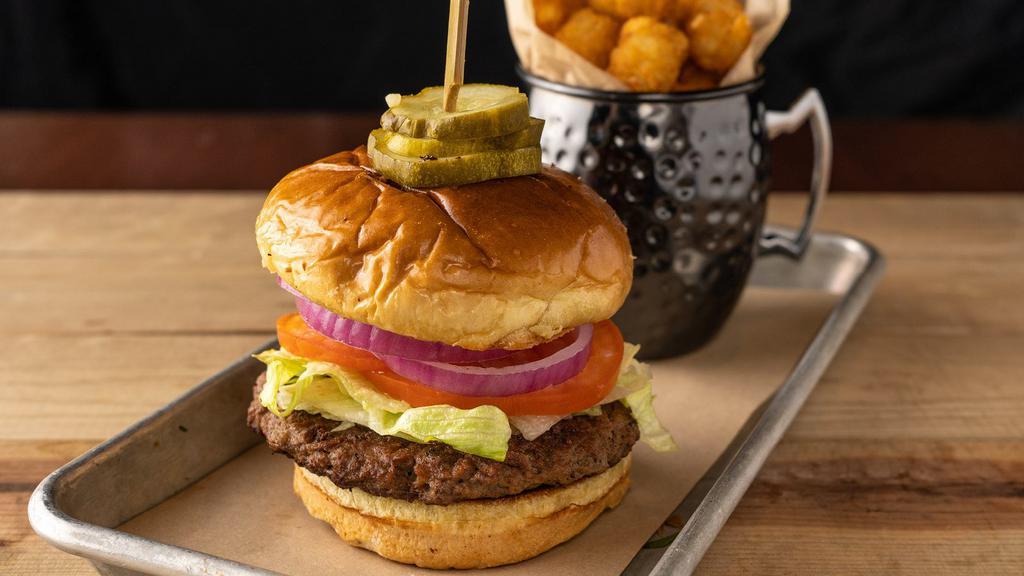 The Impossible Burger · plant-based burger made for meat lovers, lettuce, tomato, onion, garlic aioli, pickle chips