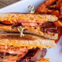 The Dalglish (Grilled Pimento Cheese Sandwich)
 · House pimento cheese made w/ cheddar & smoked gouda, cider-cured bacon, grilled tomato, sour...