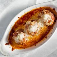 Meatballs · Baked in tomato sauce and mozzarella cheese.