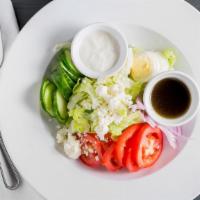 Greek Salad · Romaine lettuce, plum tomatoes, red onions, cucumbers, black olives topped with Feta cheese ...