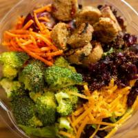 Tossed Salad · Spinach spring mix tossed with broccoli florets, cucumber, carrots and red onion, and red ca...