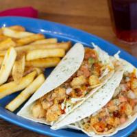 Fried Shrimp Tacos · Two soft flour tortillas filled with green cabbage, housemade Pico de Gallo, crispy onion st...