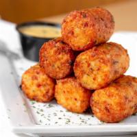 Tater Kegs · Jumbo tater tots stuffed with bacon and cheddar cheese. Served with your choice of house but...