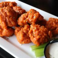 Boneless Wings · Tossed in your choice of sauce served with celery and house buttermilk ranch or blue cheese.