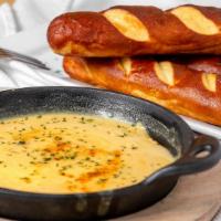 Soft Pretzels · Four pretzels with house made beer cheese queso.