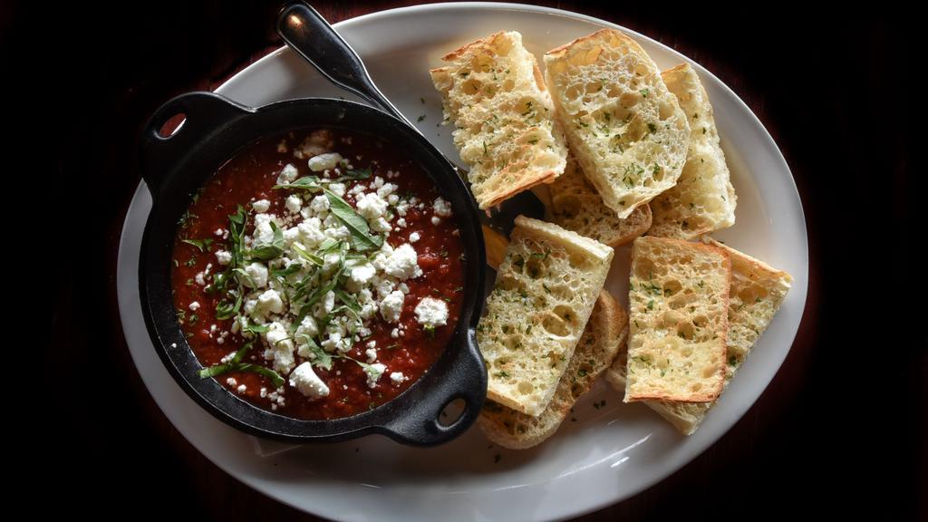 Baked Goat Cheese Marinara · Warm goat cheese, classic red sauce, fresh basil. Served with crispy bread.