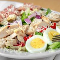 Italian Cobb Salad · Crisp romaine tossed in house buttermilk ranch dressing, with grilled chicken, onion, hard-b...