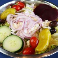 Greek · Crisp romaine lettuce, tomatoes, feta cheese, kalamata olives, red onions tossed in Greek dr...
