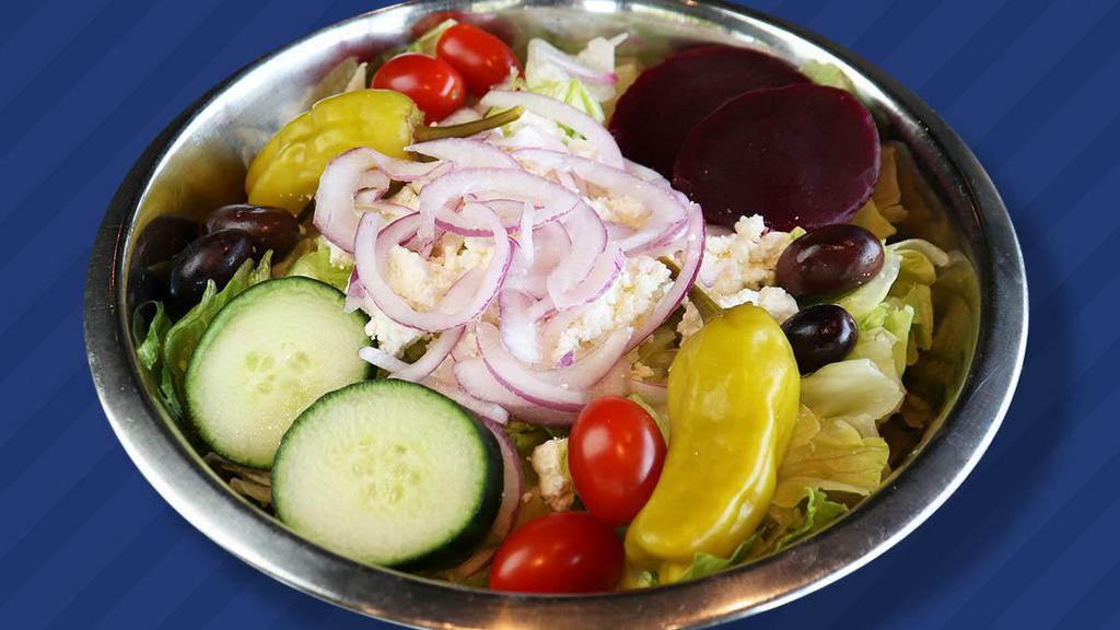 Greek · Crisp romaine lettuce, tomatoes, feta cheese, kalamata olives, red onions tossed in Greek dressing.