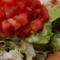 Taco Salad · A crispy flour tortilla filled with melted cheese sauce, chicken or beef, lettuce, tomatoes,...